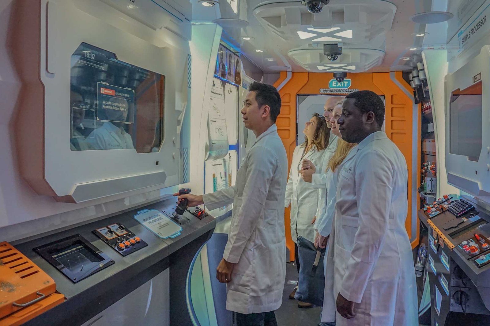 COVER_LEAPSBYBAYER Scientists in a high-tech laboratory escape game built by TBKD's experiential marketing fabricators.