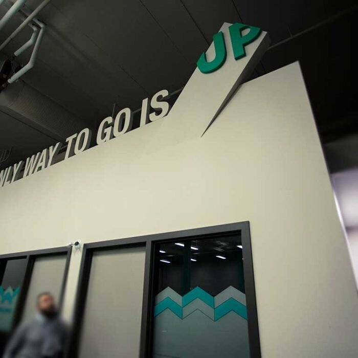 PROJECT_UP_Slogan - The Bees Knees Design Unlimited Potential's branded environments office privacy decals and dimensional slogan.
