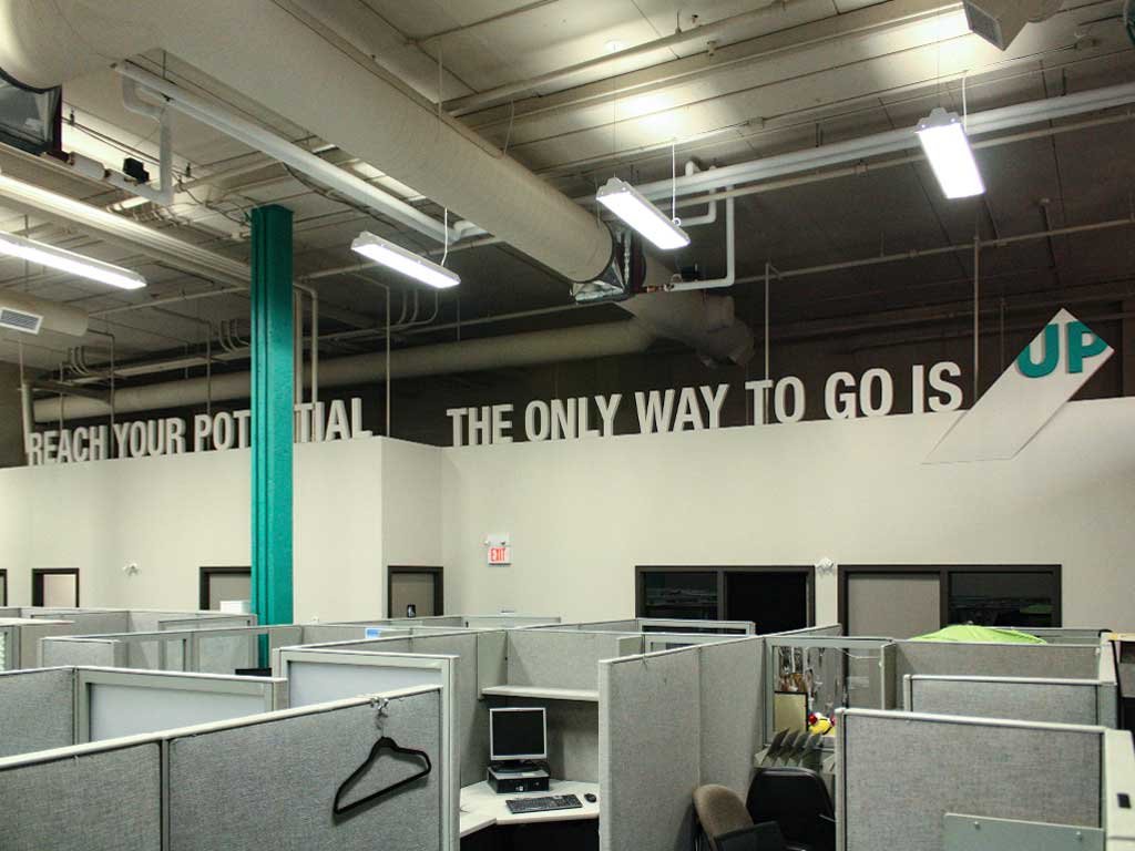 PROJECT_UP_Slogan_total Interior branding comprised of the UPCS slogan reading "reach your potential, the only way to go is UP".