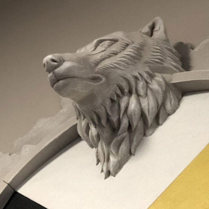 Public_MpowR_Wolf - The Bees Knees Design Medicine wheel sculpture with a wolfs head mounted on a wall
