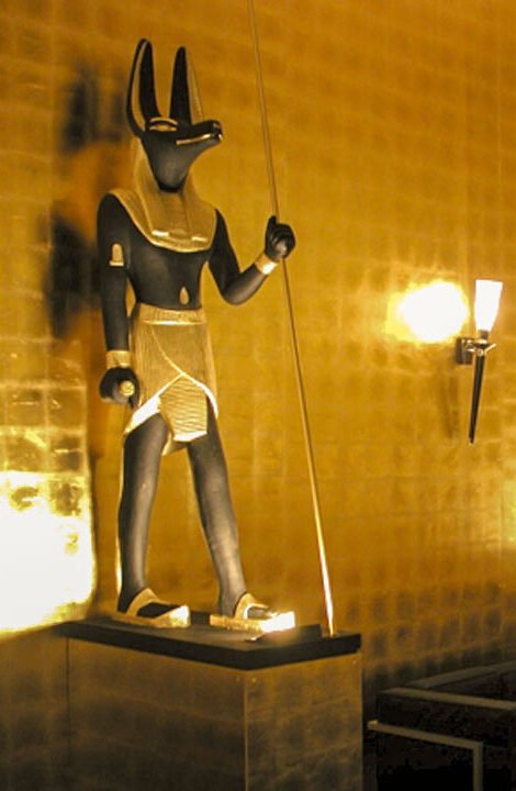 Theming_Anubis_Pair Giant 7 feet tall golden Anubis sculptures themed attractions in a museum lobby.