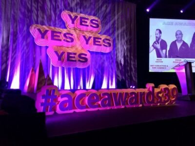 44753985_340252826540759_710695685942411264_n Stage fabrication of a custom stage backdrop reading yes, yes, yes and a hashtag on the stage front edge reading #aceawards39.