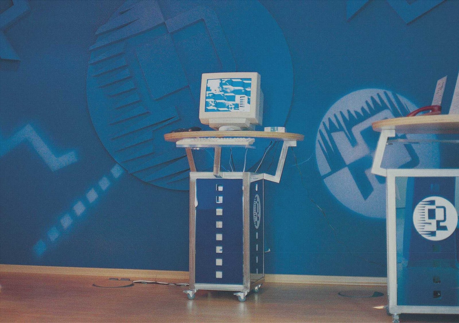 COVERS_Environments_3 Blue branded walls and custom mobile computer desktops as part of Bintec's marketing installations.