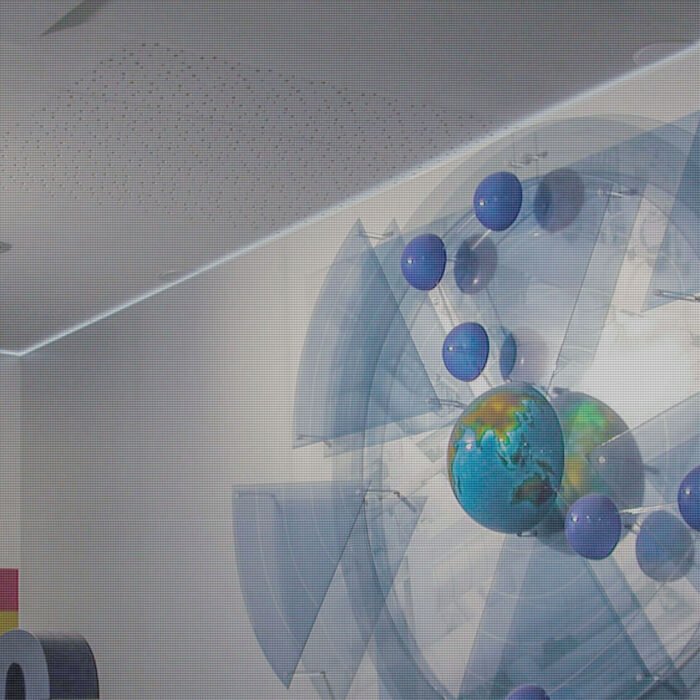 Abstract custom event fabrication with a globe, blue spheres and event displays design.