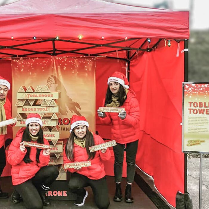 LANDSCAPE_Toblerone - The Bees Knees Design Toblerone bars stacked to build a tower in a pop-up display at a brand activation event | TBKD. experiential pop-up.