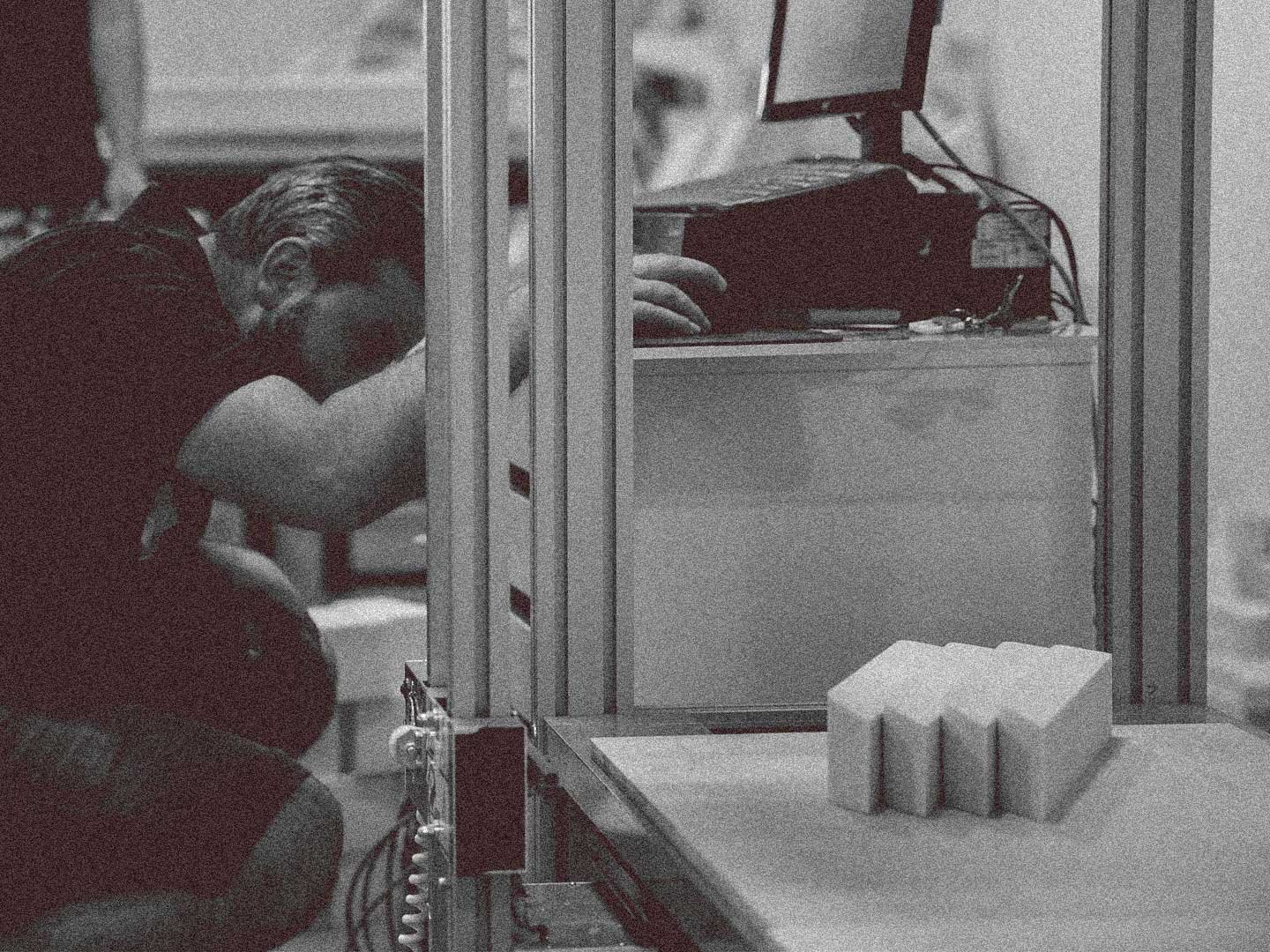 Brand_Activation_Fabrication Person working with CNC machinery at a brand activations fabrication facility.