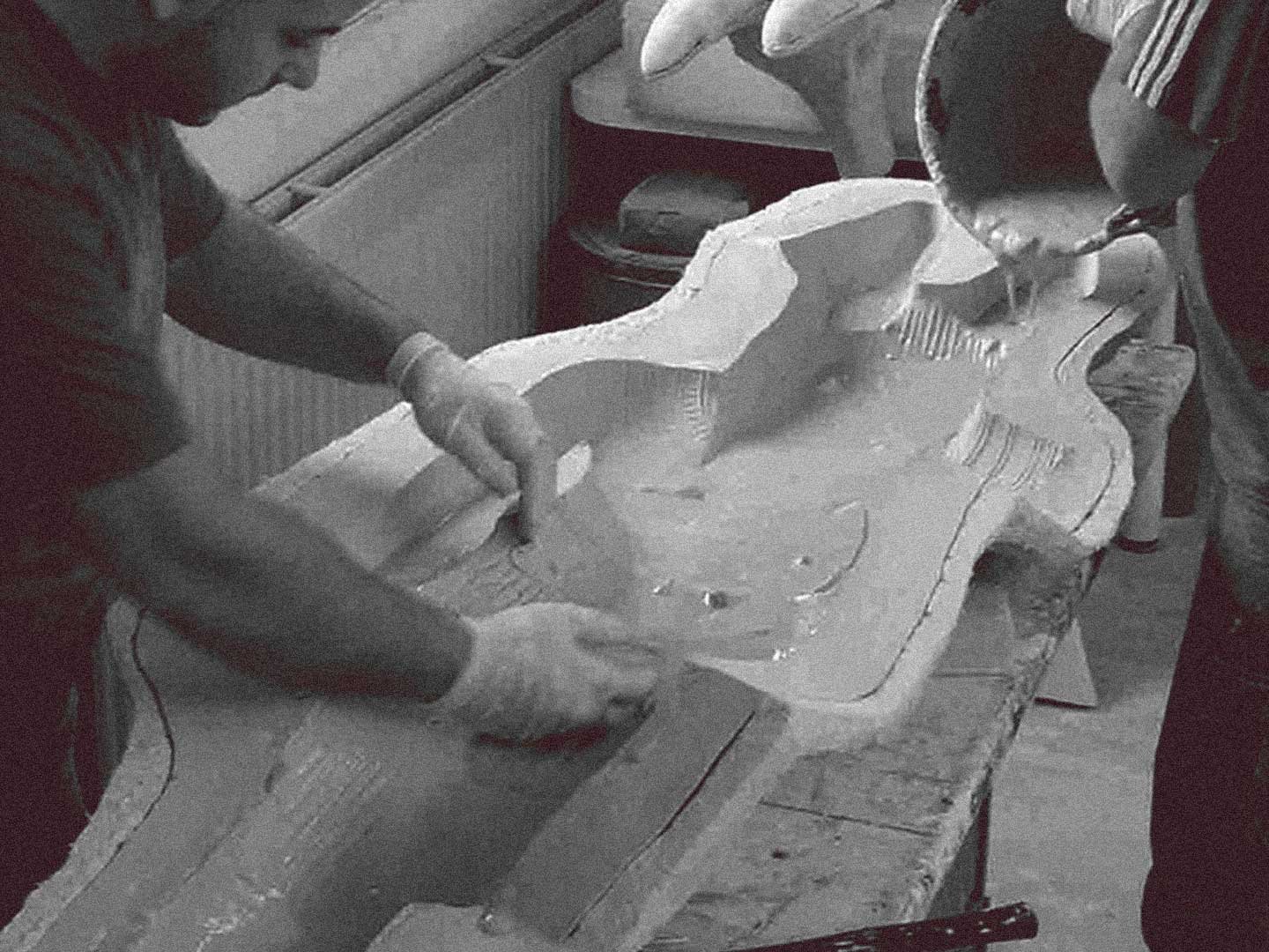 Casting_Into_The_Mold Two people casting Anubis foam sculptures into a mold.