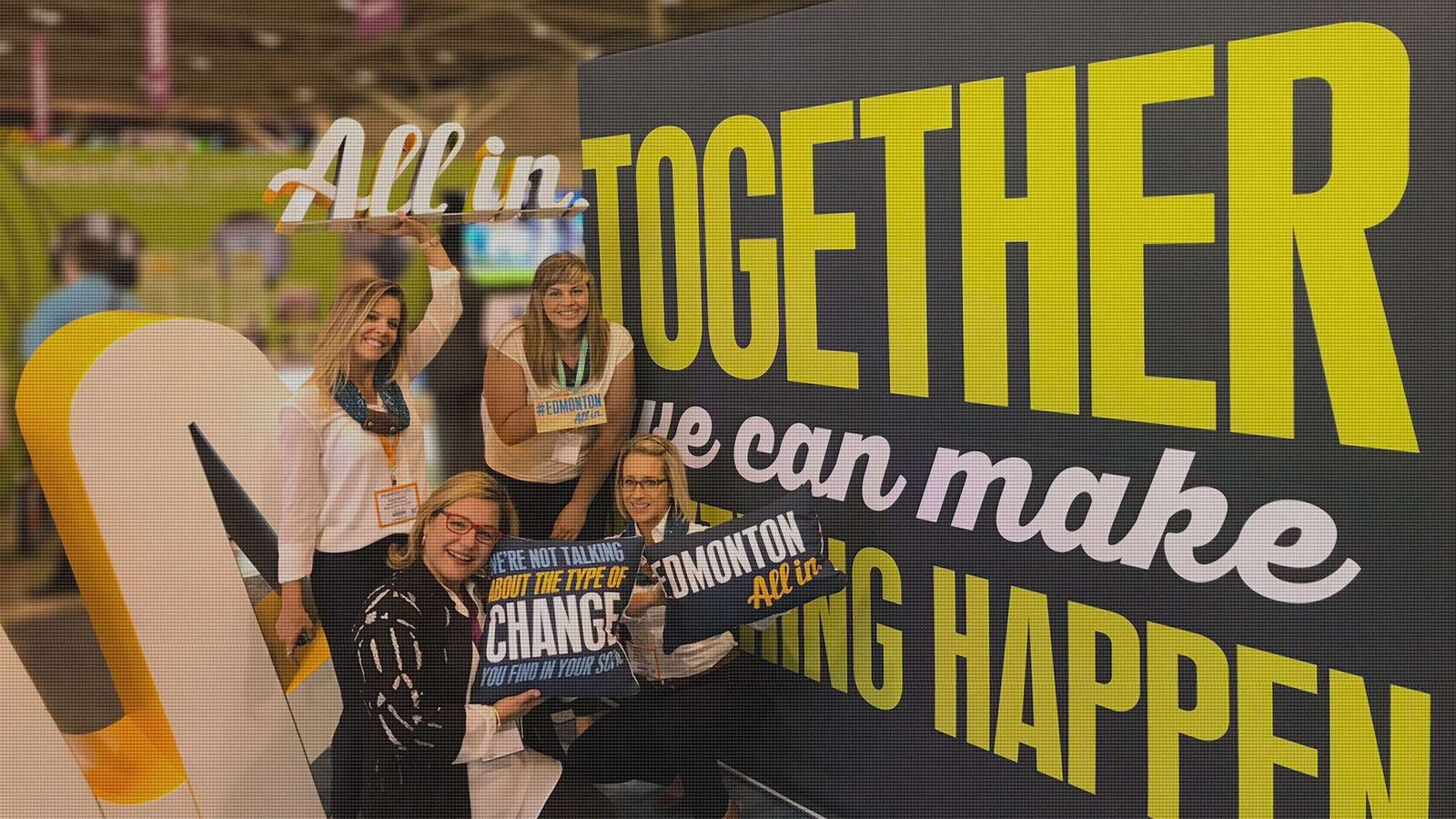 Photo op fabrication: Women posing with photo ops in a trade show booth kiosk.