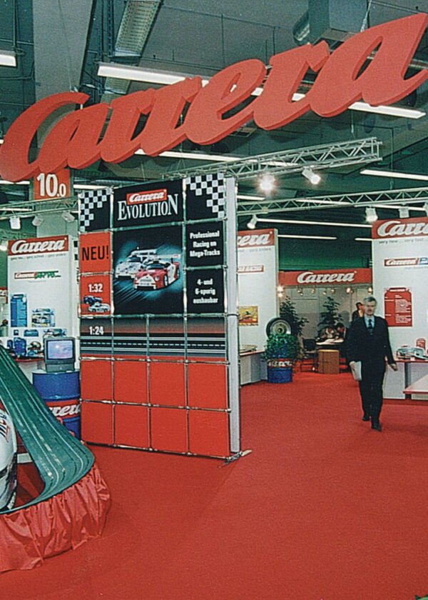 Carrera_Trade_Show_Hanging_Signs Oversized red Carrera trade show hanging signs hovering over the booth.