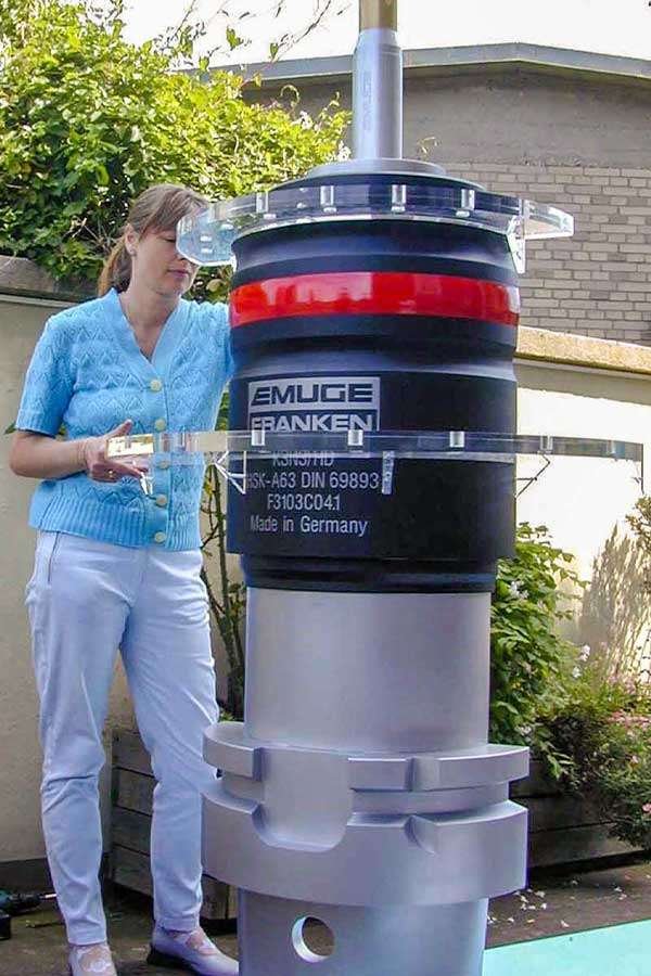 EMUGE_Replica_Displays_Person A woman holding a EMUGE Franken chuck product replicas.