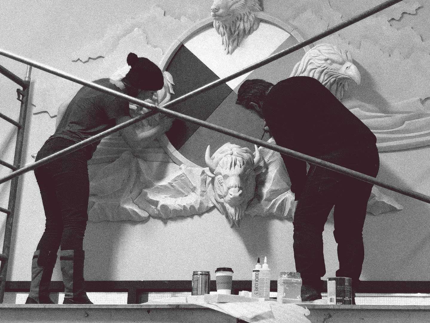 Experiential_Marketing_Fabricators_MpowR Experiential marketing fabricators on a scaffold installing a custom medicine wheel foam sculpture in Edmonton.