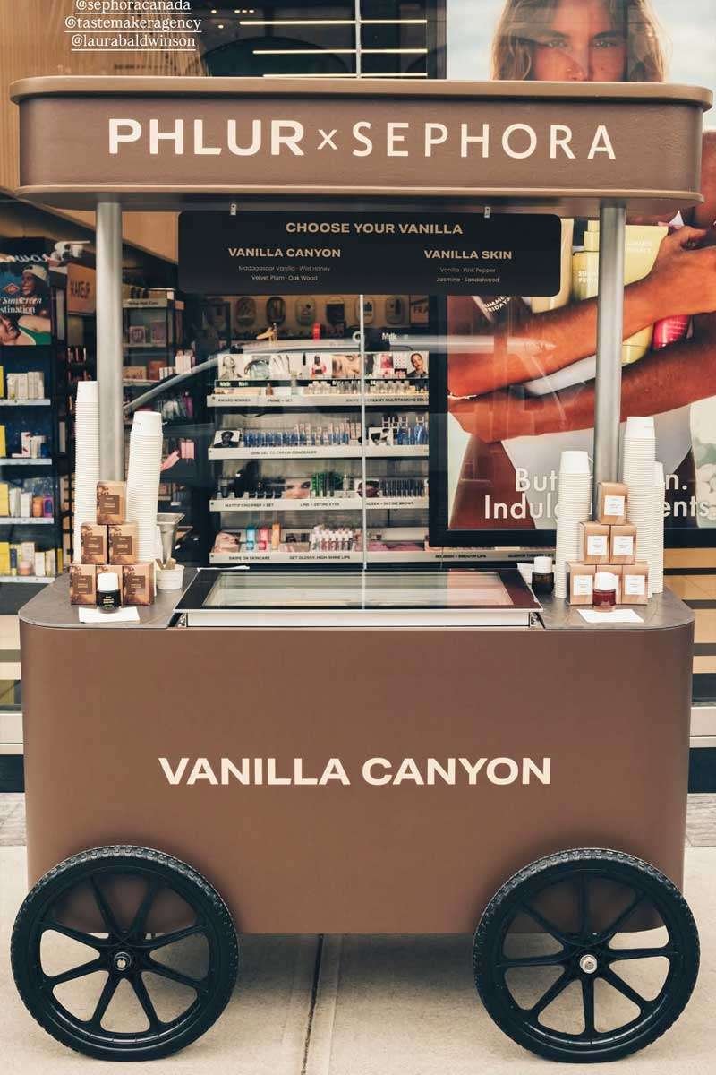 PHLUR_Sephora_Cart_Full The PHLUR Sephora branded ice cream cart in front of a Sephora retail store.